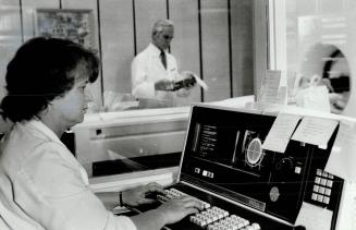 Donna McGraw sits a computer console at Scarborough General, on screen is a brain scan