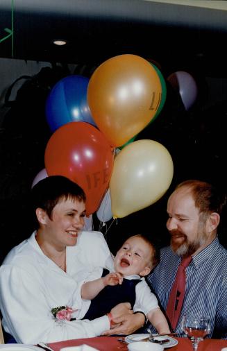 Tiina Soomet and Michael Maltby beam with pride over their 15-month-old son, Aleksander, at a party thrown by Toronto East General Hospital yesterday (...)