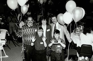 Twin delight: Dr. Murray Kroach, left, with Noni and Stephen Cherry, whose 8-year-old sons Sean, left, and Ian, were Canada's first test-tube twins