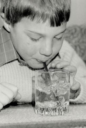 Bubbies: Asthma sufferer Chad Forsey blows bubbles in a glass of water as part of a breathing exercise