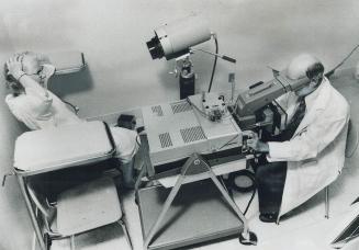 Step three: Dr. Leo Mahoney, director of St. Michael's breast diagnosis clinic, operates a $29,000 infra red, closed circuit TV camera called a thermo(...)