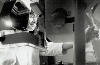 Reducing risk: X-ray technician Marie Kiley prepares to do a mammogram on a patient at a Scarborough clinic