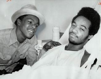 Heroes of rescue attempt, Conrad Pinnock, 18 and Peter Brown, 18, discuss the event in York-Finch Hospital where Brown is being treated for severely b(...)