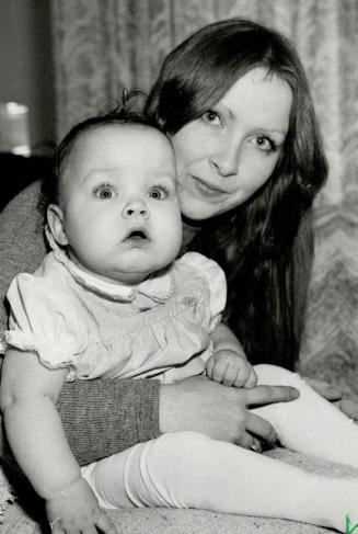 Short-lived help: Pat Brett says on Ontario government therapist sent to her home to help with baby Heather, who has cerebral palsy, was taken off the case just as Heather was improving