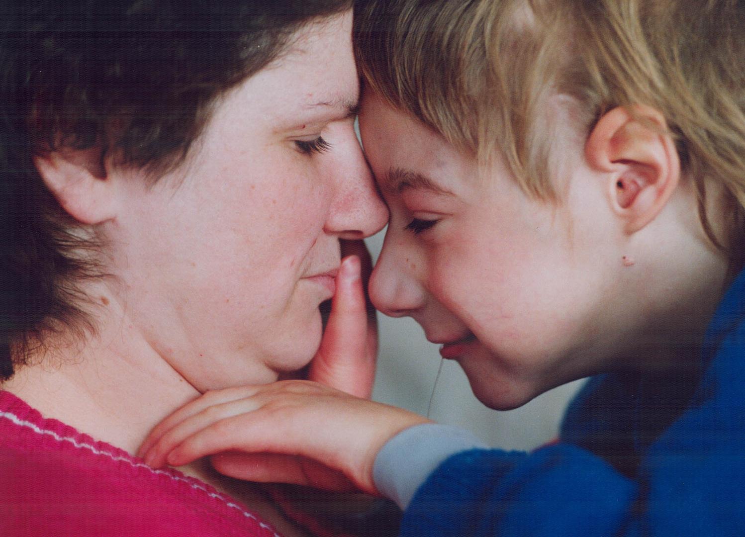Joan Almey enjoys a tender moment with her 7-year-old son, Tommy, who wasn't expected to survive the genetic disorder trisomy 13. He has every right to live, she says
