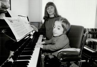 Tragic disease: Above, Sherrill Barrie and 11-year-old Donald, who has never walked