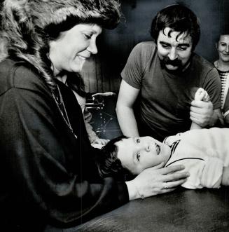 Arm exercises: Volunteer Liz Pigden and Hugh McGroggan move Hughie's arms in the hope his brain eventually will pick up the motor signals and start responding itself again