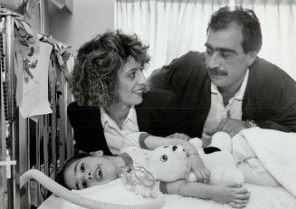Joyful News: Silvana and Fred Panetta stay near their dying daughter Sabrina, 9, at York-Finch General Hospital yesterday, after learning she can go home Ontario decided to pay for a full-time nurse