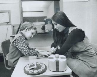 A 6-Year-old boy, mute and retarded, gets coaching from speech therapist Helen Egar at the Mental Retardation Centre on Surrey Pl. When the treatment (...)