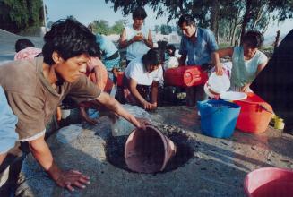 Peru - Villagers just outside Lima using well water as main source even though possibility of cholera contamination exists. The area smelled of rotting sewage