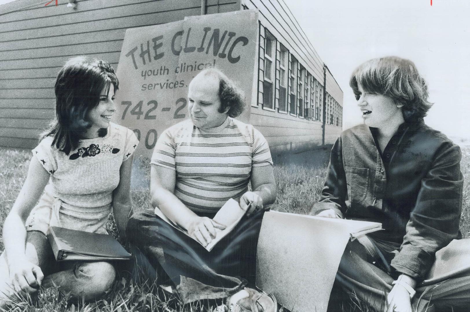Comparing Notes on the day's problems outside the Clinic are intake worker Heather Sant (left), and counsellors Clark Heaton and Janice May. It has op(...)