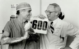 Scrubbing up: Dr. George deVeber (right) and Dr. Gerald Cook of Toronto Western Hospital prepare to perform the hospital's 600th kidney transplant. Co(...)