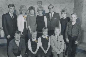 Four of the nine children of Mr. and Mrs. Ed Crawford have shown congenital Heart Defects, Family includes (standing) twins John and Judy, Joan, Mr. a(...)