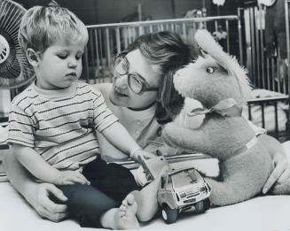 New toys and a new heart helper, With a newly installed atomic-powered pacemaker regulating his heart, 2 1/2-year-old Michael Helder of Hagersville, O(...)