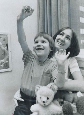Six-year-old Mark Kelly, like most children his age, probably will be opening his presents under the tree this Christmas. But unlike most boys, Mark n(...)