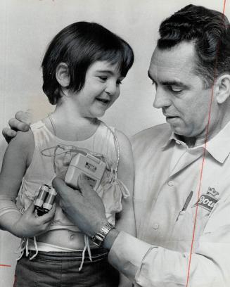 Lifesaving pacemaker held by John O' Halloran is all that stands between his daughter Rosemarie, 5, and death
