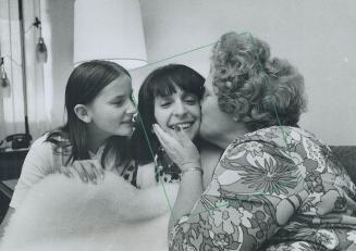 A homecoming hug - Mrs. Sandra Frederick, 25, is embraced by her mother, Mrs. Bernice Morin, when the daughter returned home yesterday from Texas afte(...)