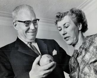 Mr. and Mrs. Douglas Ham, He's showing how large 'bubble' on his heart was