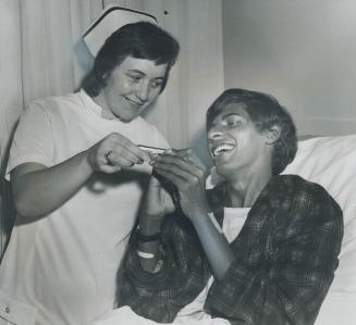 Tommy Sookdeo and nurse Mary Hehir, Mouth organ - and new life - were gifts from friends