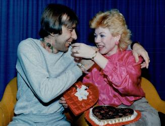 Linda Bell shares chocolates with husband, Bob, from her early Valentine's Day gift