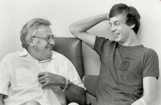 Peter Alley, left, with son, Tom, 20 relax before operation