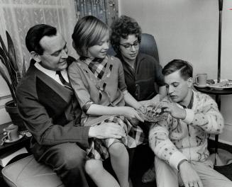 Kidney transplant recipient Arthur Van Zandt relaxing at home, With him are his wife, Doreen, daughter Barbara, 10, and son, Barry, 18