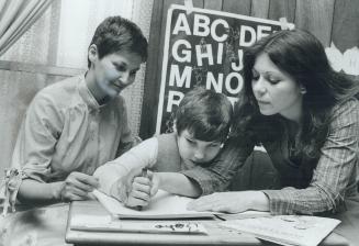 John Vollett, 9, with mom Elaine (left), teacher Loretta Brill