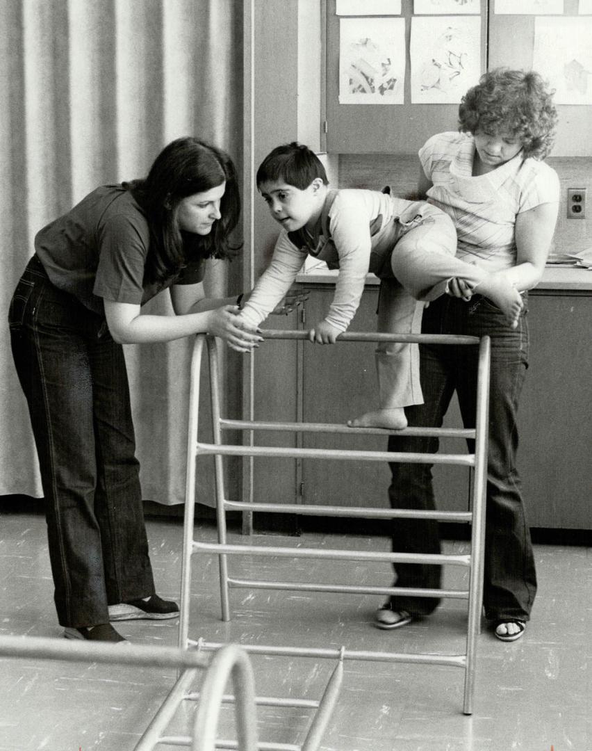 Special help: Instructors Ellen Lustig, left and Karen Wionzek work with retarded child at Keelesdale Public School