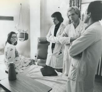 Ready, set. . .: Mrs. James, just before her momentous operation, chats with hospital staff