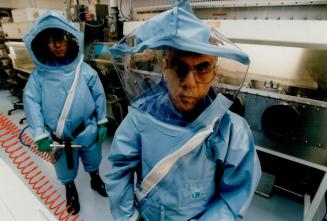Dr Mohammed Mahdy & Wilson Chaing in Super-Sealed lab for dangerous exotic diseases