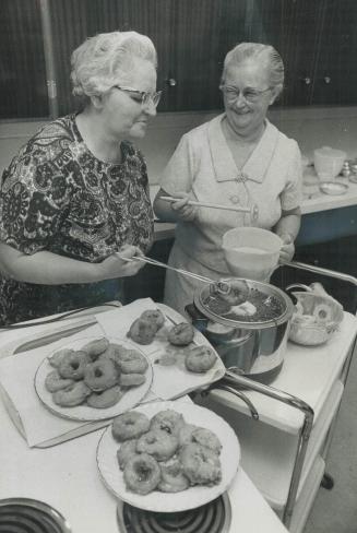 Sizzling apple fritters are served on the spot during the Mennonite Relief Sale