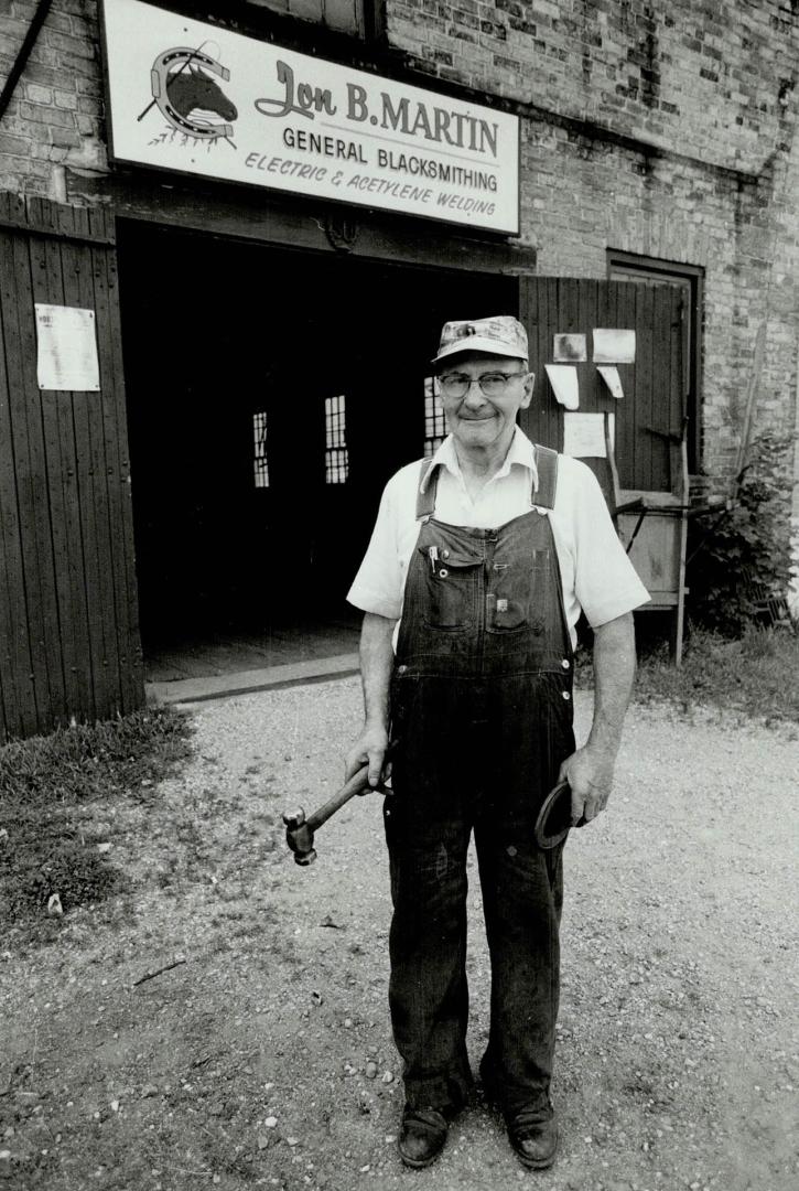 Town blacksmith: Jon Martin still fixes wagon wheels and pounds red hot horseshoes on his anvil as he did 40 years ago, but much of his business is repairing farm machinery