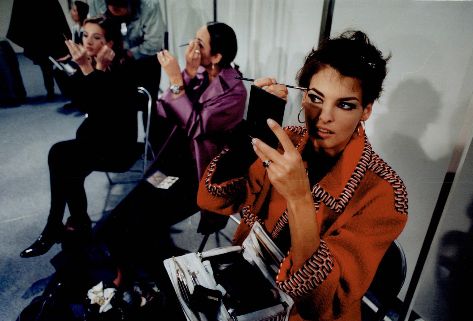 Top, the more experienced models, including Canadian born Linda Evangelista, do their own makeup