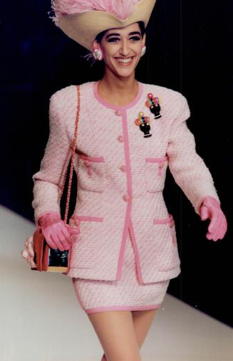 Above, Giselle on the runway in a pink tweed suit for spring