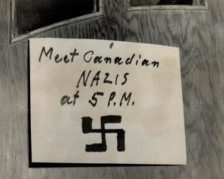 Sign on Nazi 'Headquarters', Told of meeting scheduled today