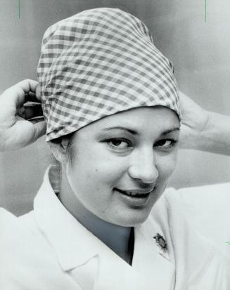 Jen Jerry prefers the fresh crisp look of green and white check cotton in her surgery headgear designed high on top