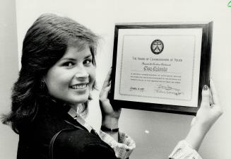 Chased suspect: Lisa Lalonde, 23, a nurse at the Hospital for Sick Children, displays the award she got for chasing a suspect after a 6-year-old patient was sexually assaulted in the hospital