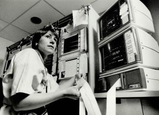 Registered nurse Lucinda Lahey monitors a telemetry scanner - which shows a heartbeat - in Wellesley Hospital's intensive care unit