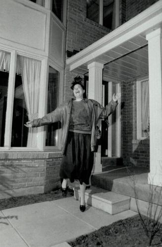 Luck of the Irish: Dorothy Thibodeau, a nurse at Queen Street Mental Health Centre, kicks up her heels in front of the $250,000 home she won in the Centenary Hospital draw