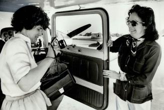 Photographer Betty Innes (left) checks her equipment before taking off with pilot Shirley Allen on a flying photo mission for the Ontario Ministry of (...)