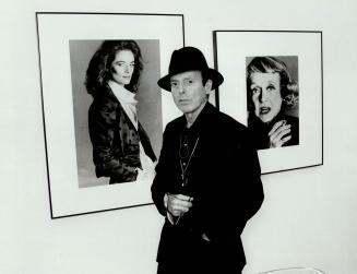 Francesco Scavullo: Celebrity photographer stands in front of his portraits of Charlotte Rampling, left, and Bette Davis