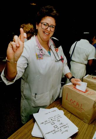 Ballots Away: Queensway Hospital nurse Chris Anderchek casts a vote yesterday in favor a contract offer to Ontario's 49,000-plus nurses