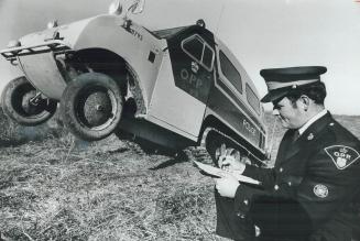 Go anywhere, Constable Doug Andrews takes notes on the Bombardier Snowmobile he's learning to drive