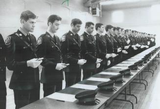 Tunes of glory? Recruits to Peel Regional Police are seen taking oath of office