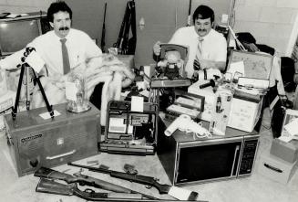 Loot recovered from Sutton Break-ins, Constable John Sheldon (left) and Constable Bill Claughton of York Region police check over some of the $30,000 (...)