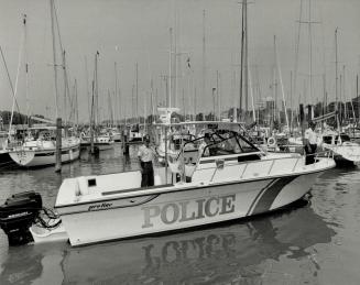 Sleek craft: Patrol boat given to Peel police by The Star joins two smaller vessels of the force's marine unit to give police increased range in its boating safety campaign