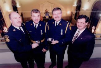Four officers left to rt, Daniel Parkinson (staff superintendent) - chief Catney, Ronald Bain (deputy chief) and Larry Button (chief administrative officer)