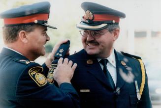 Ron Bain, 43 (right), Peel Regional Police Chief Norl Catney (left)