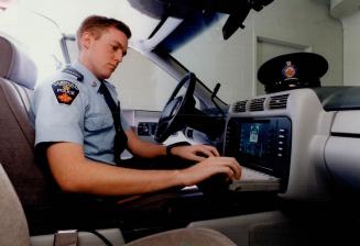 Dunham police cadet Phil Edgar in - high-tech cruiser