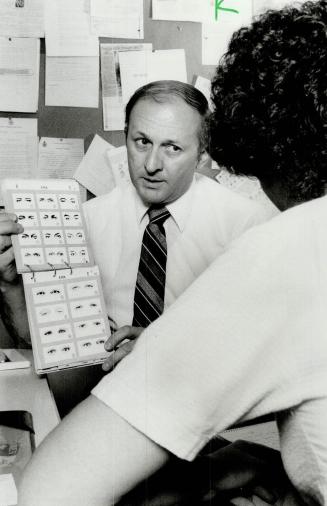 One peek's enough: Staff Sergeant John Found of the Durham Regional Police shows eye chart from which a witness can identify another person after a single glance